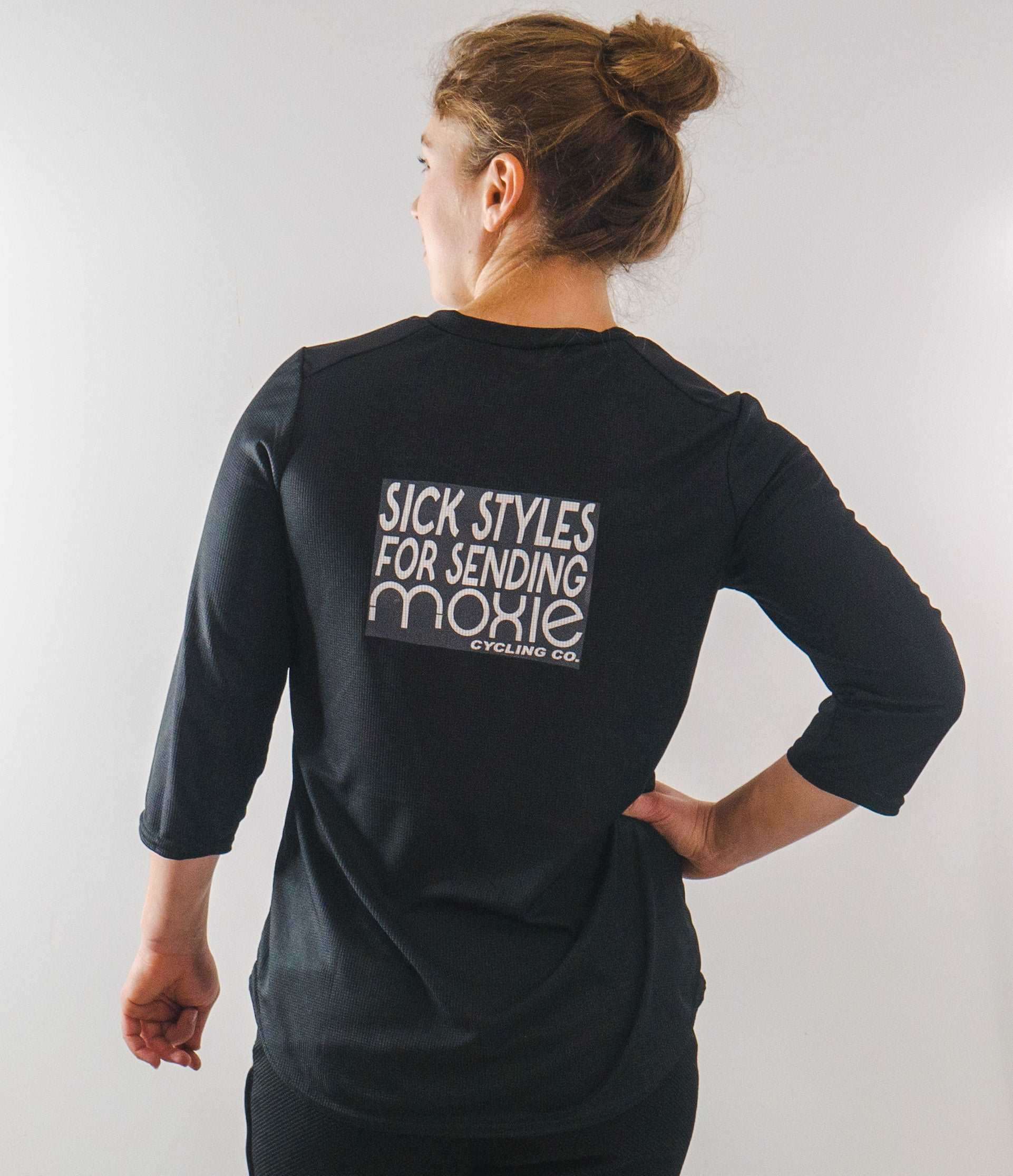 Happy Mountain Bike Jersey with breathable mesh fabric, three-quarter sleeves, and looser fit.